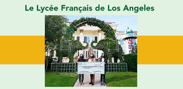 Le Lycee Francais de la Los Angeles staff holding a big chec